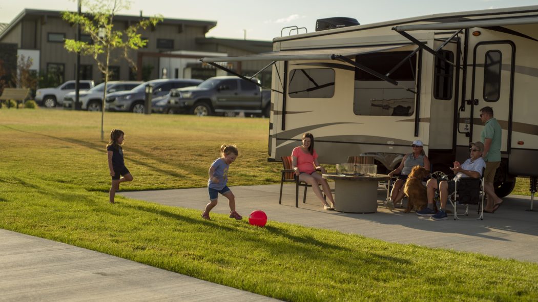 Kids playing in front of an RV