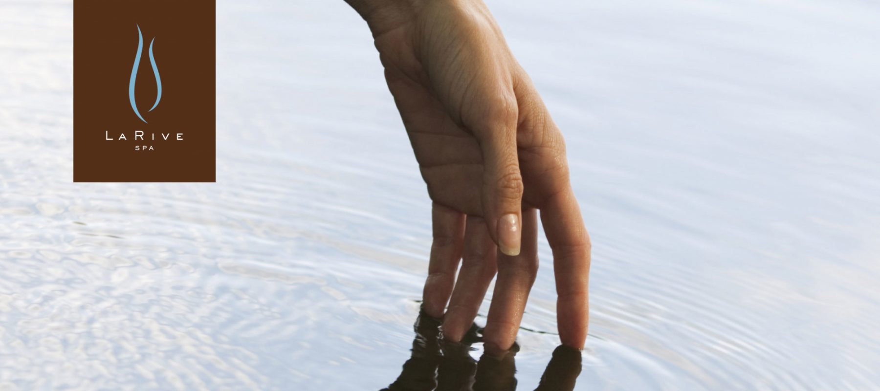 Spa Woman with Hand in Water